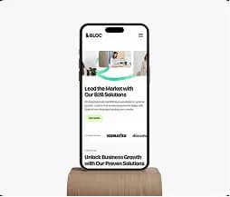 Smartphone displaying a business website homepage